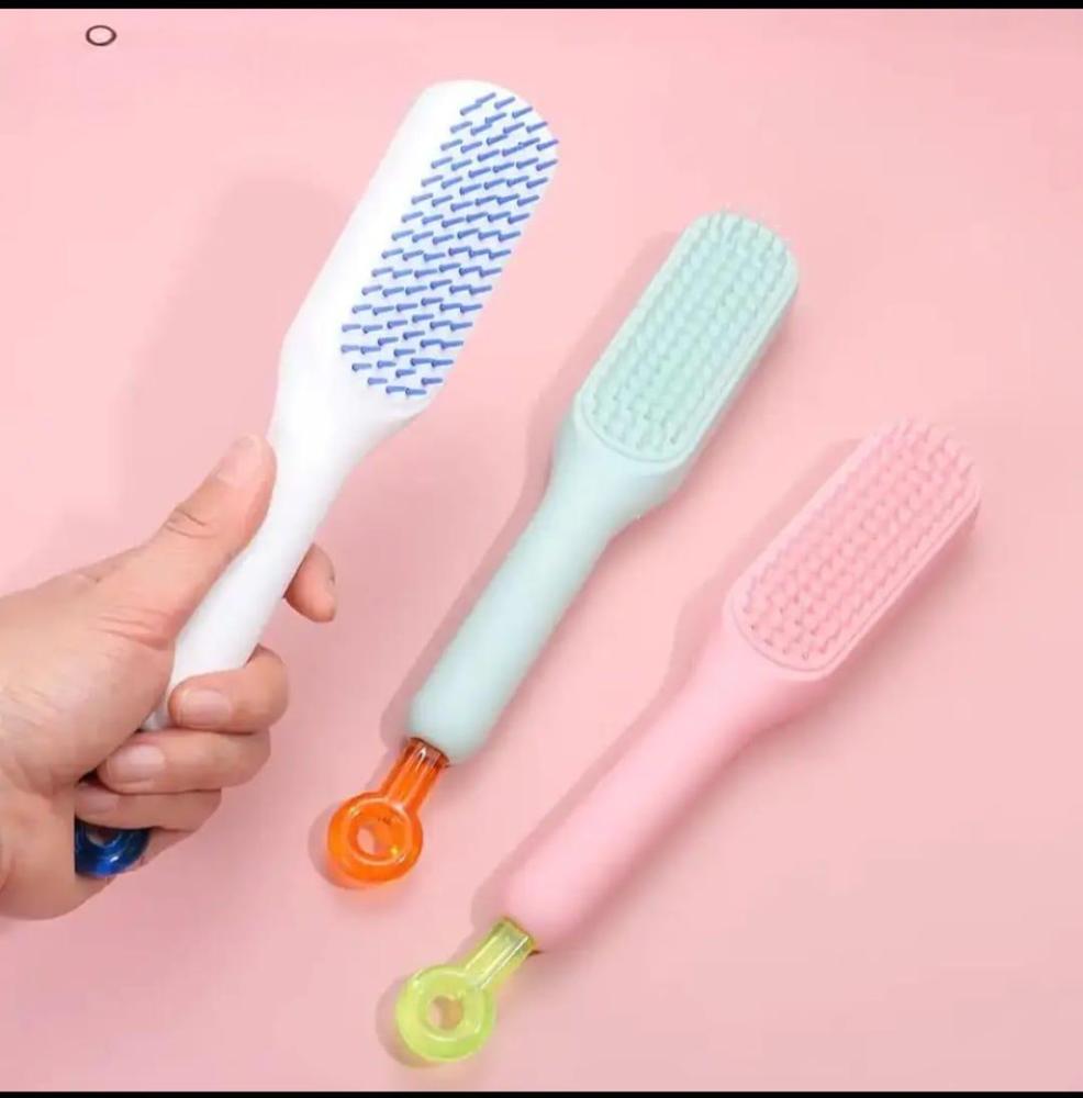 Self cleaning hair comb